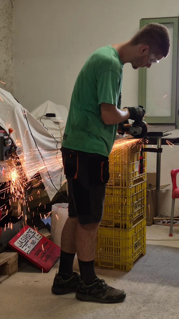 My cousin, an industrial engineer, helping out with the new metal structure.