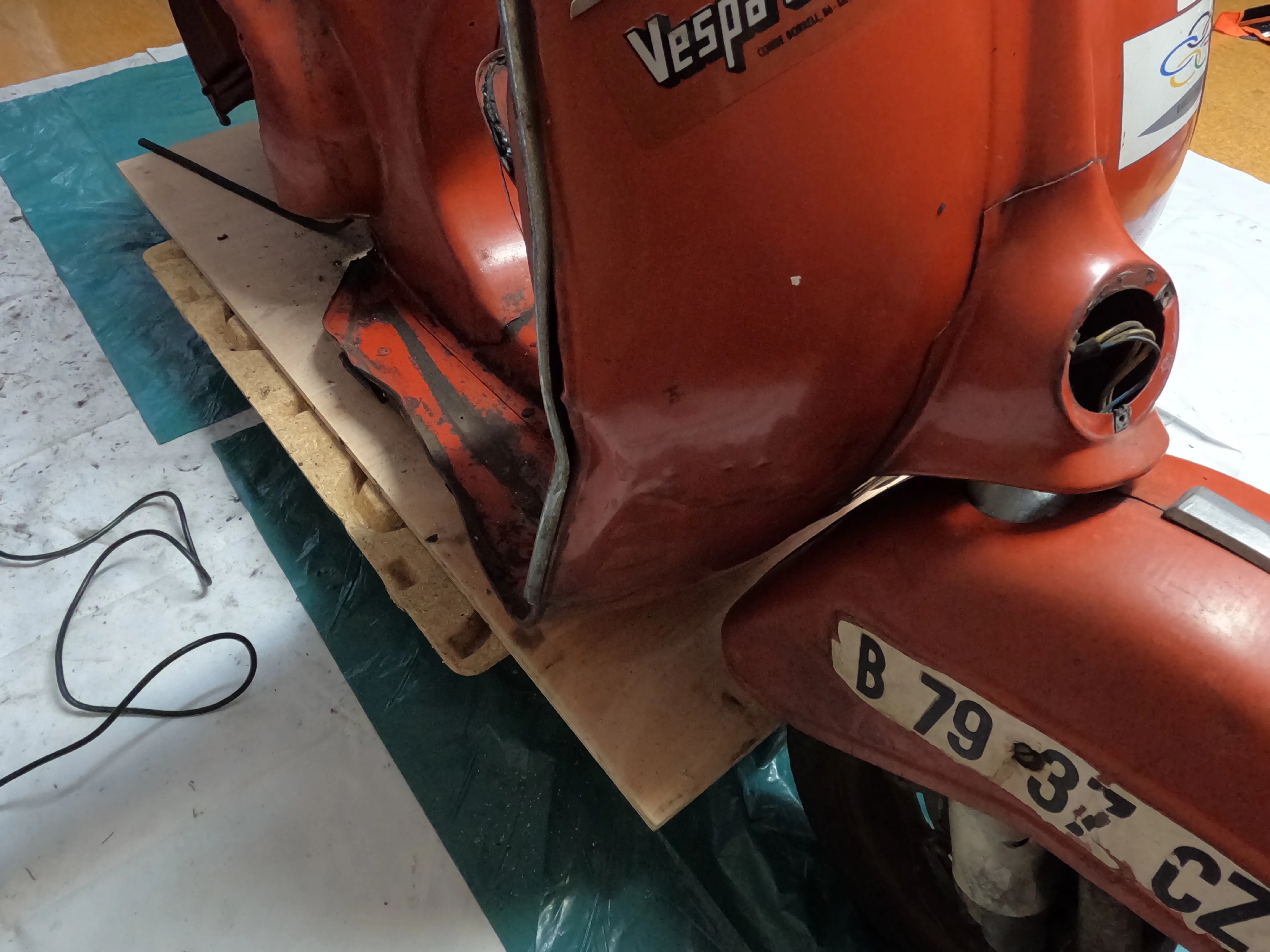The Vespa as it arrived: fifty years old, dented, and not running.