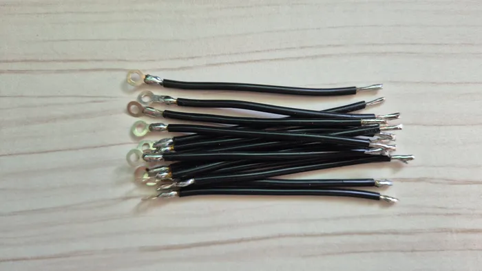 A stack of finished leads, cut, stripped, and tinned ahead of assembly.